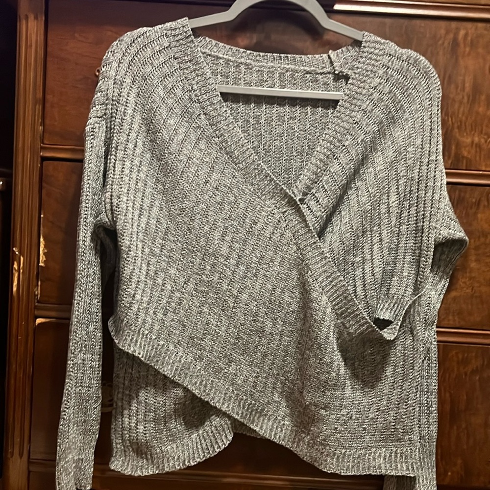 Grey and black marbled sweater.